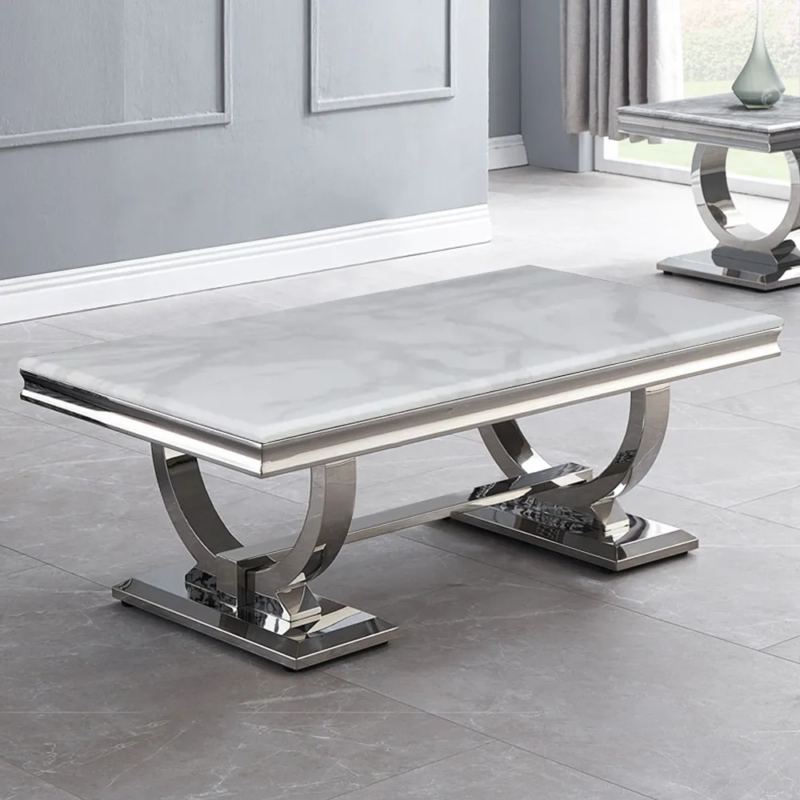 Luxury dining table with six chairs featuring modern stainless steel and a marble top, available for customization.