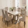 Luxury dining table with six chairs featuring modern stainless steel and a marble top, available for customization.