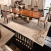 Modern luxury dining table with premium marble top and elegant metal base for stylish home interiors.