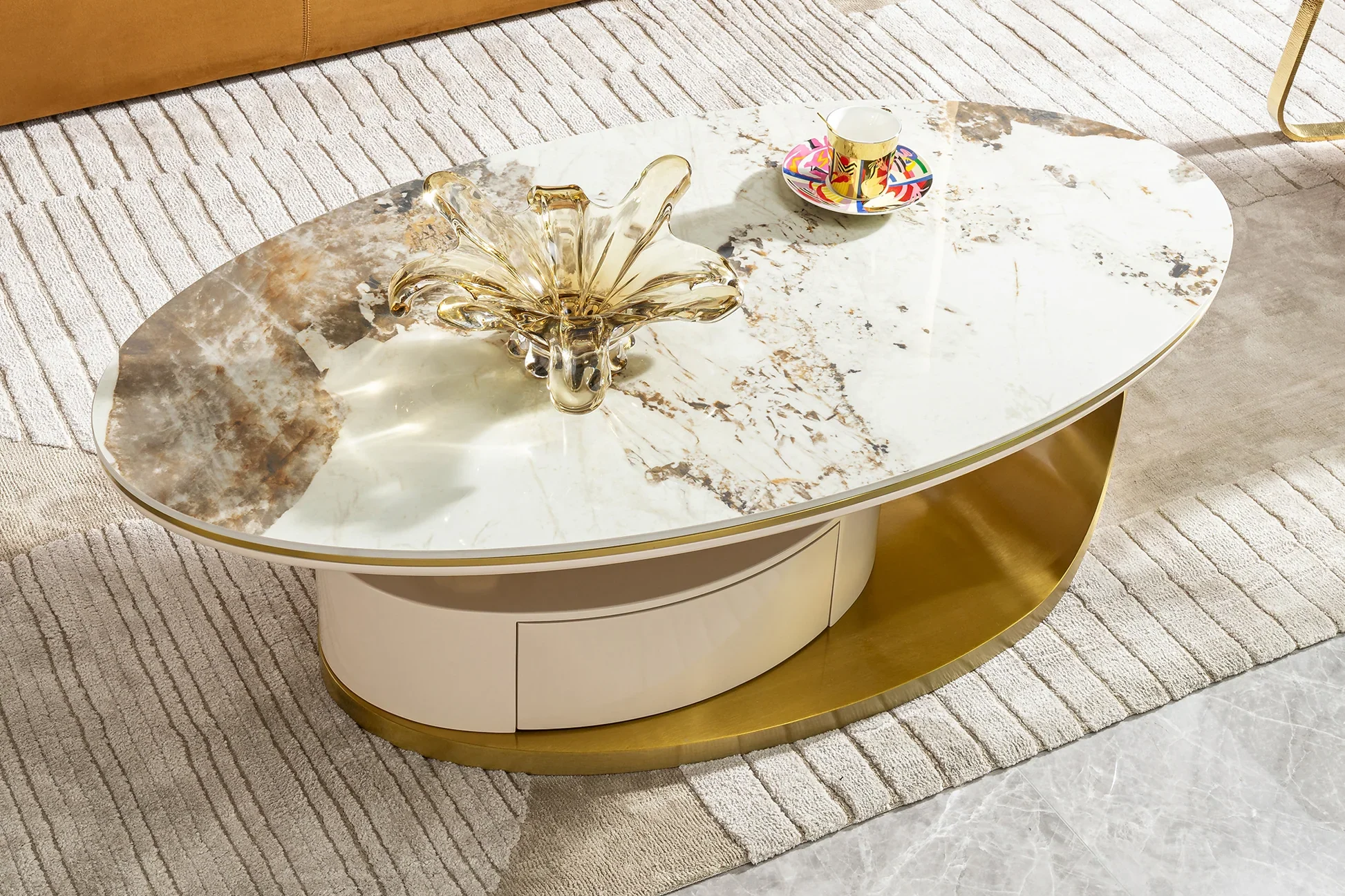 Overhead view of oval white marble coffee tabletop with unique natural veining