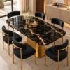 Alvara Luxe gold vein marble dining table with gold pedestal base and upholstered chairs