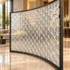 ArcScallop curved premix glass partition with textured scallop pattern