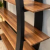 Arvento curved black retail display rack with five wooden-look shelves
