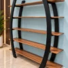 Arvento curved black retail display rack with five wooden-look shelves