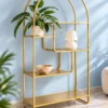 Aurelia Arc arched cosmetic display rack with gold frame and asymmetrical shelves
