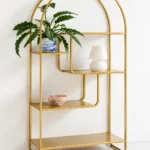 Aurelia Arc arched cosmetic display rack with gold frame and asymmetrical shelves