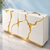 Aurelia Flow gold inlay console table with white cabinet storage and abstract gold detailing