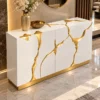 Aurelia Flow gold inlay console table with white cabinet storage and abstract gold detailing
