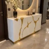 Aurelia Flow gold inlay console table with white cabinet storage and abstract gold detailing