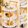 Aurelia Round marble serving trolley with white surfaces and gold frame
