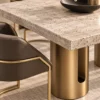 Aureon Luxe marble dining table with gold pedestal base and upholstered chairs