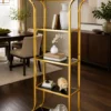 Aurevia Luxe gold multi tier display rack with open shelves and curved frame