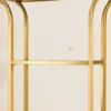 Aurevia Luxe gold multi tier display rack with open shelves and curved frame
