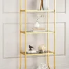 Aurevia Luxe gold multi tier display rack with open shelves and curved frame