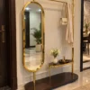 Aurevia standing mirror with clothes rack and gold stainless steel frame