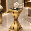 Aurex Geo jewelry pedestal display case with gold base