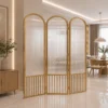 Aveline Arch three-panel fluted glass partition with gold frames and arched tops