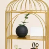 Aviora Luxe birdcage display rack with gold frame and multi-tier shelves