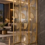 Cirque Luxe folding textured glass partition with gold frame