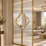 Clover Luxe textured glass partition with Gold PVD frame