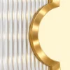 Clover Luxe textured glass partition with Gold PVD frame