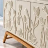 Elora Bloom floral design TV cabinet with raised botanical doors and wood-look base