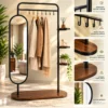 Elvara standing mirror with garment rack and shelves in black stainless steel frame