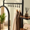 Elvara standing mirror with garment rack and shelves in black stainless steel frame
