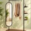 Elvara standing mirror with garment rack and shelves in black stainless steel frame