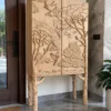 Forest Song two-door wooden cabinet with raised tree and bird carving