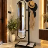 Movara mobile standing mirror with clothes hanger and black stainless steel frame