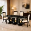 Orion black dining table with three gold sphere supports and four cream chairs