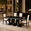 Orion black dining table with three gold sphere supports and four cream chairs