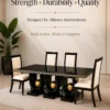 Orion black dining table with three gold sphere supports and four cream chairs