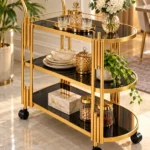 Orlena Luxe rounded edge serving trolley with gold frame and black serving surfaces