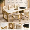 Orlena Luxe white marble dining table with gold base and upholstered chairs