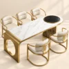 Orlena Luxe white marble dining table with gold base and upholstered chairs
