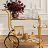 Regalia Wheel designer serving trolley with gold frame and large spoked wheel
