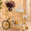 Regalia Wheel designer serving trolley with gold frame and large spoked wheel