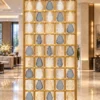 Ruby Drop decorative premix glass partition with Gold PVD grid