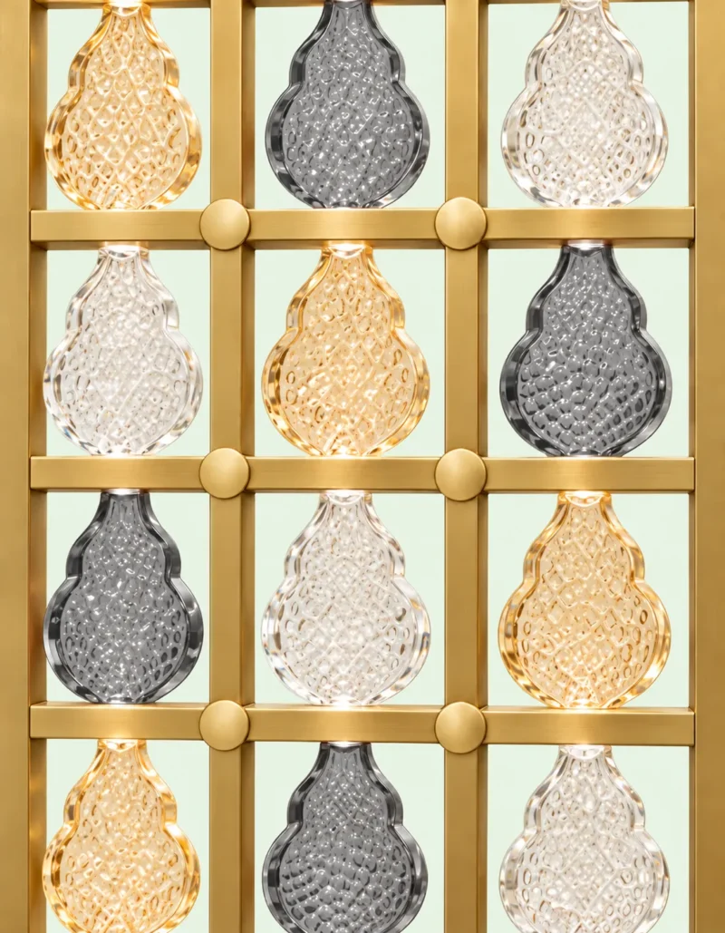 Ruby Drop decorative premix glass partition with Gold PVD grid