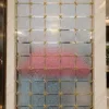 Stella Grid premix glass partition with Gold PVD frame