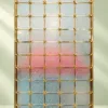 Stella Grid premix glass partition with Gold PVD frame