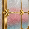 Stella Grid premix glass partition with Gold PVD frame