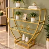 Velora hourglass cosmetic display rack with curved gold frame and three open shelves