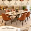 Veyra Cross marble dining table with dark sculptural base and four upholstered chairs