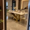 Veyra Loop geometric marble dining table with gold stainless steel base