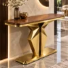 Veyron Geo geometric gold console table with faceted pedestal base and wood-look top