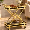 Xavia Luxe diamond frame serving trolley with gold structure and black serving surfaces