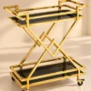 Xavia Luxe diamond frame serving trolley with gold structure and black serving surfaces